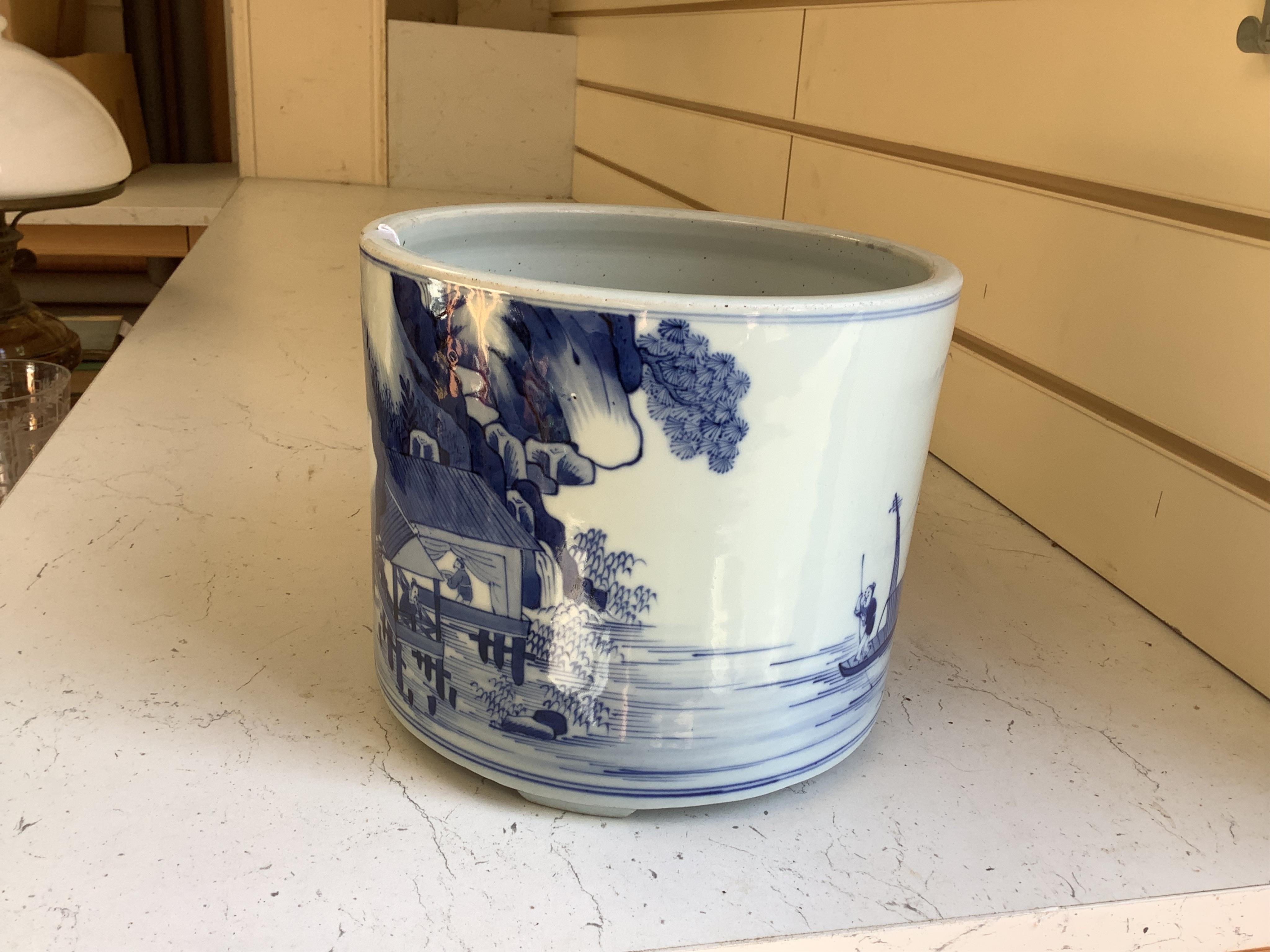 A Chinese blue and white brushpot, 17cm high. Condition - good